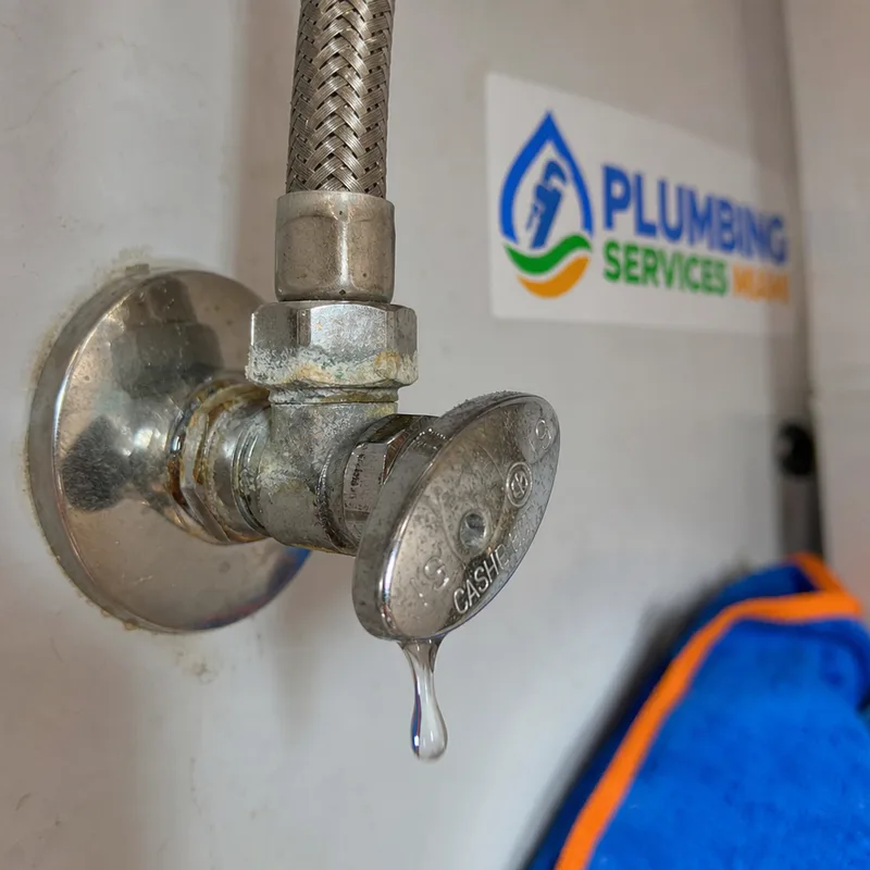 Dripping angle stop valve with mineral buildup on the compression nut